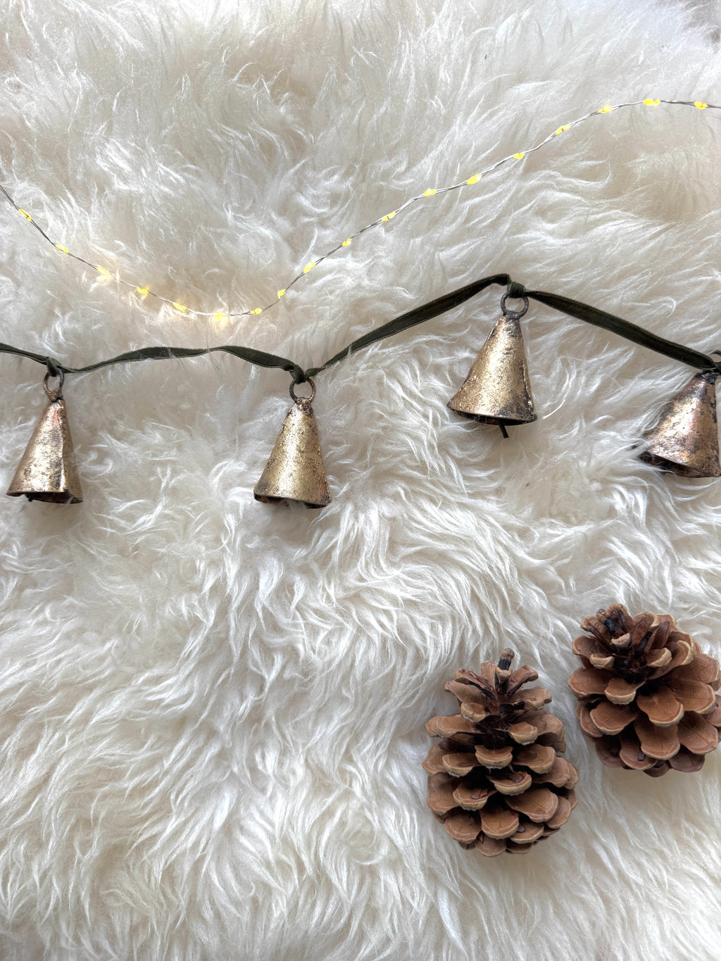 Brass bell garland on velvet ribbon