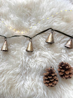 Brass bell garland on velvet ribbon