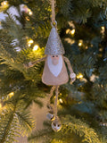 Wooden Santa with dangling legs