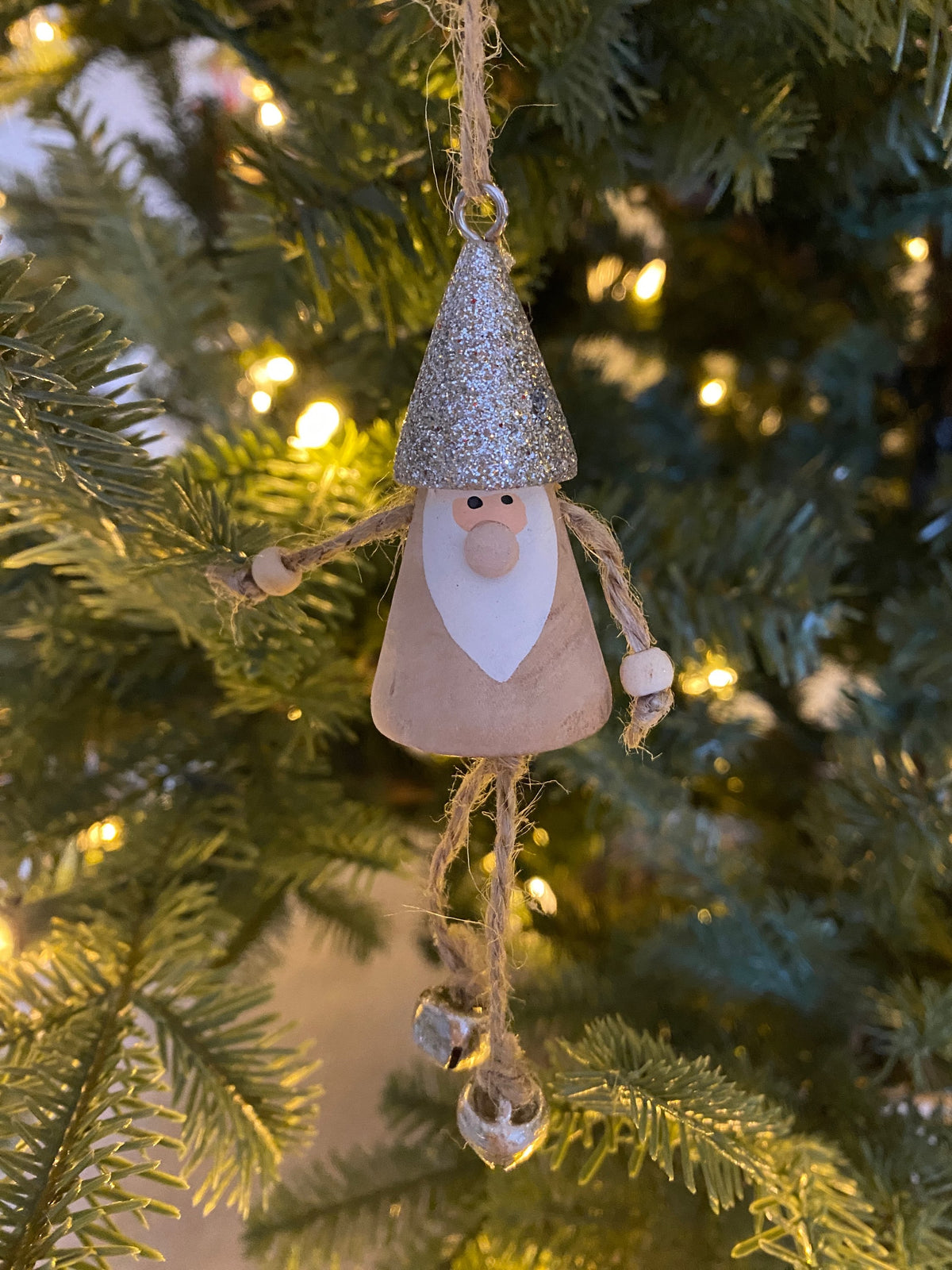 Wooden Santa with dangling legs