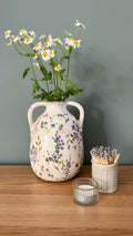 Distressed floral urn