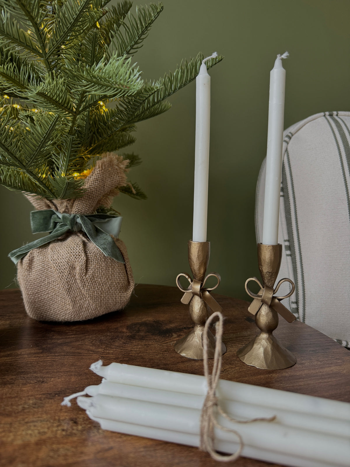 Antique brass bow candle holder