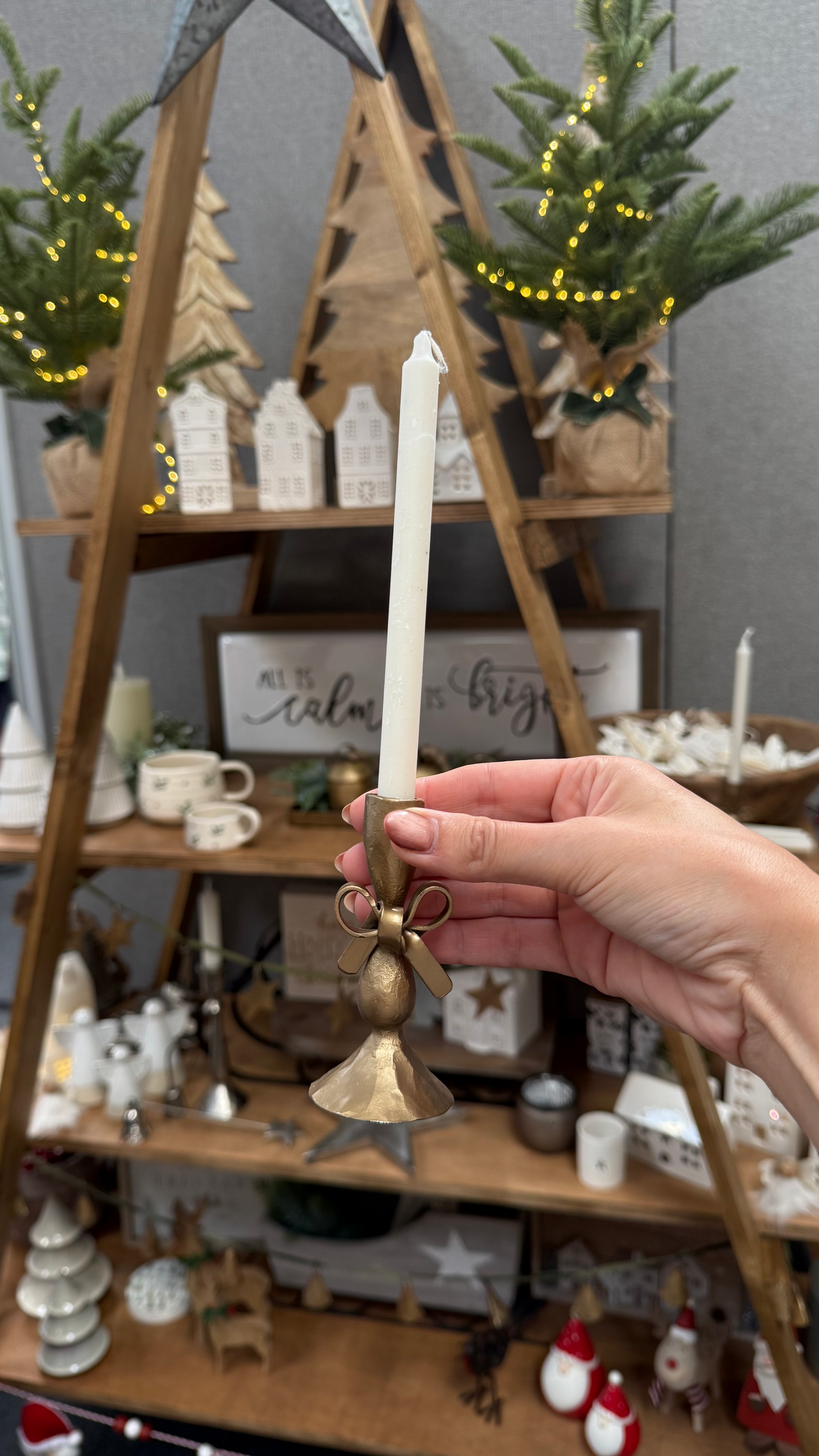 Antique brass bow candle holder