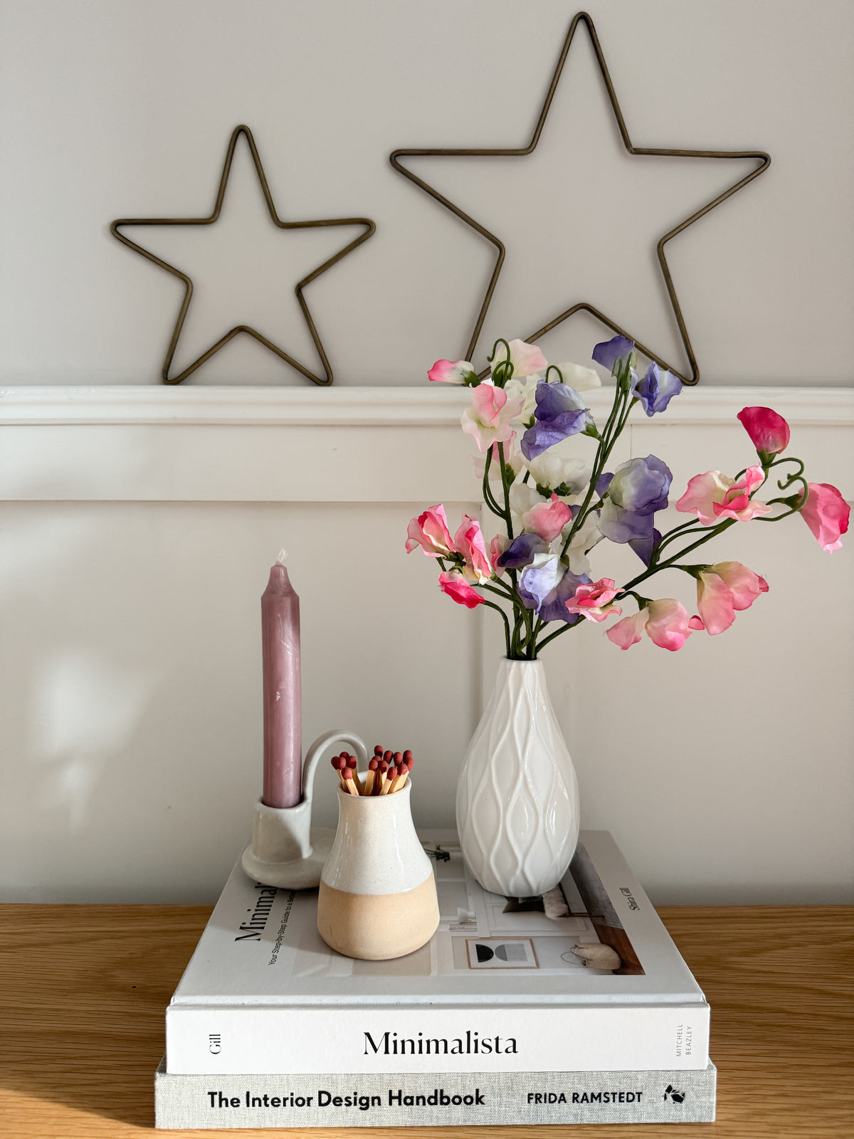 Sweet peas in white bud vase