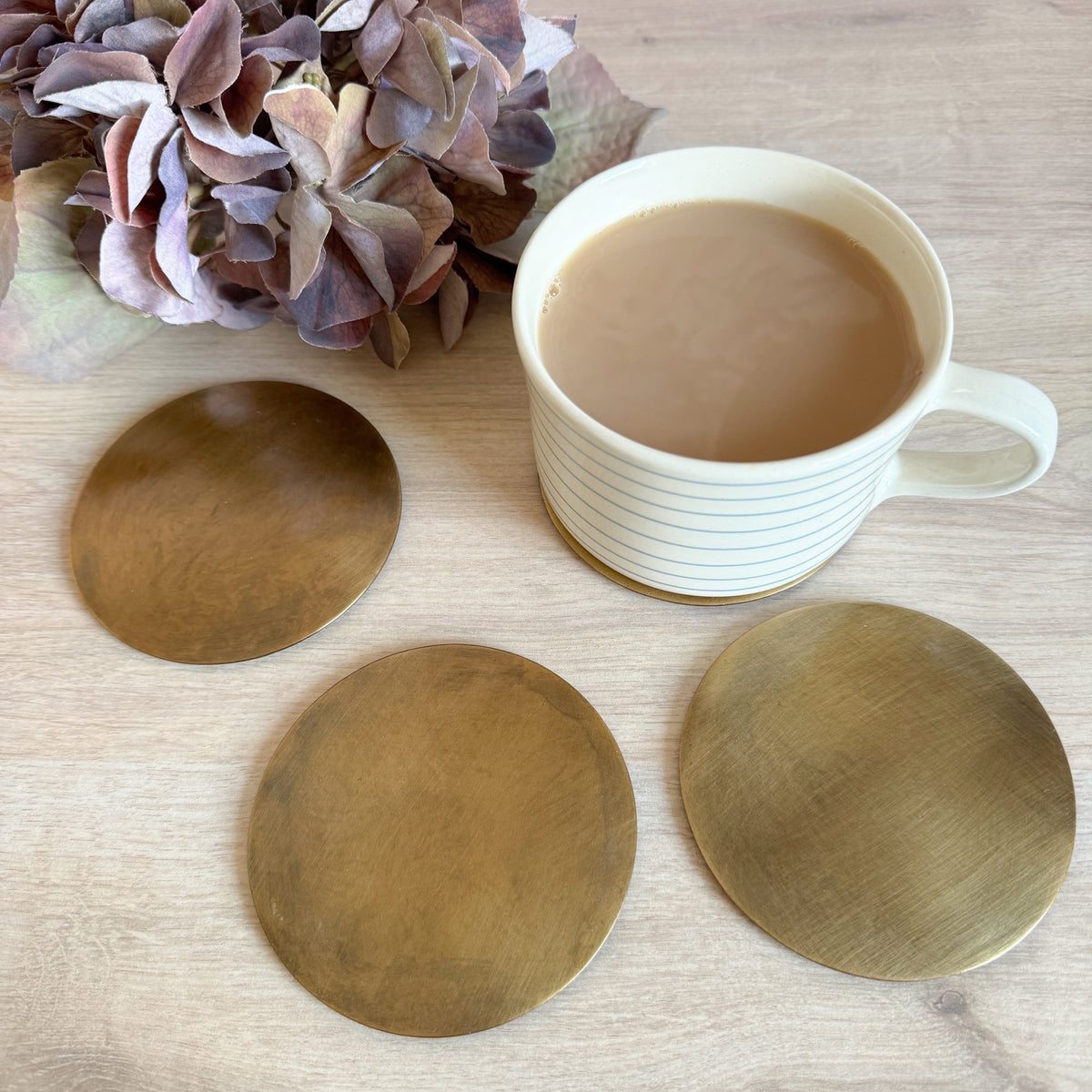 Set of 4 brass coasters