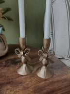 Antique brass bow candle holder