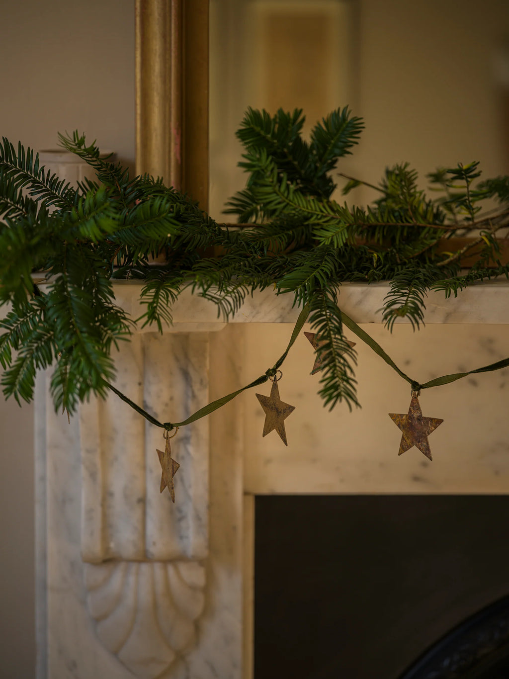 Brass star garland on velvet ribbon