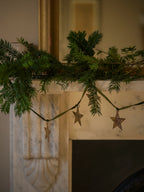 Brass star garland on velvet ribbon