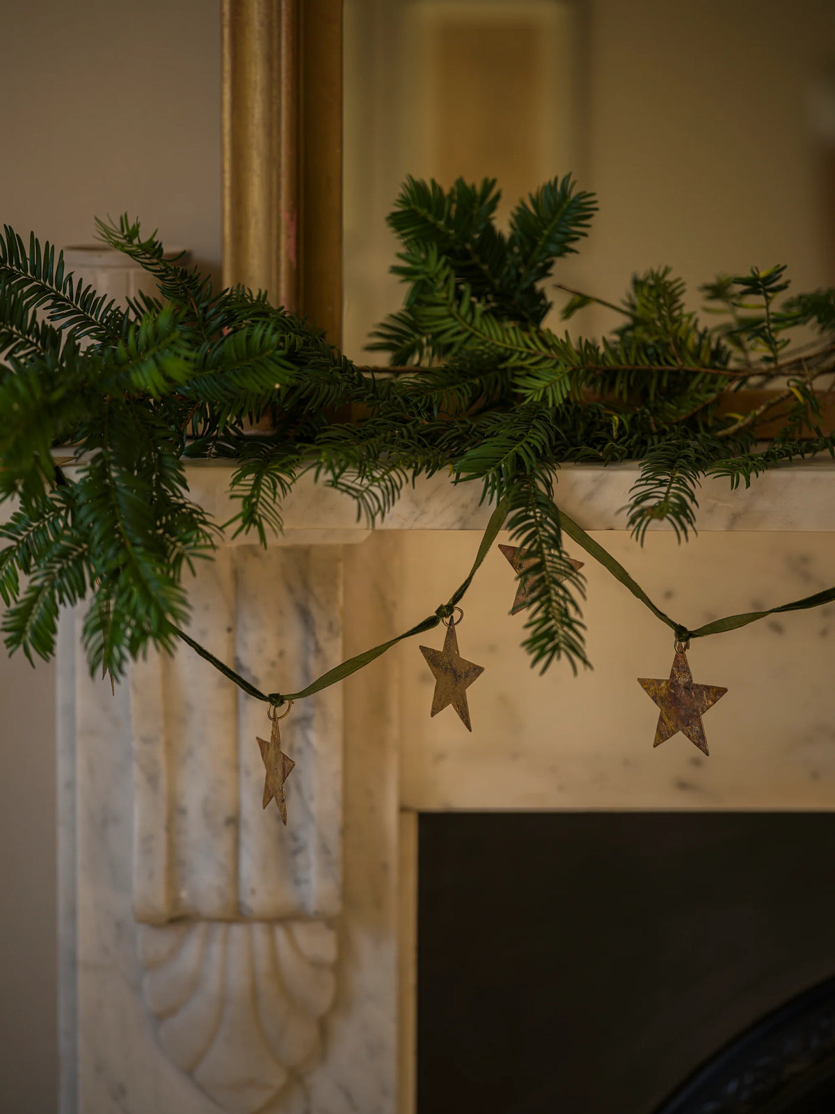 Brass star garland on velvet ribbon