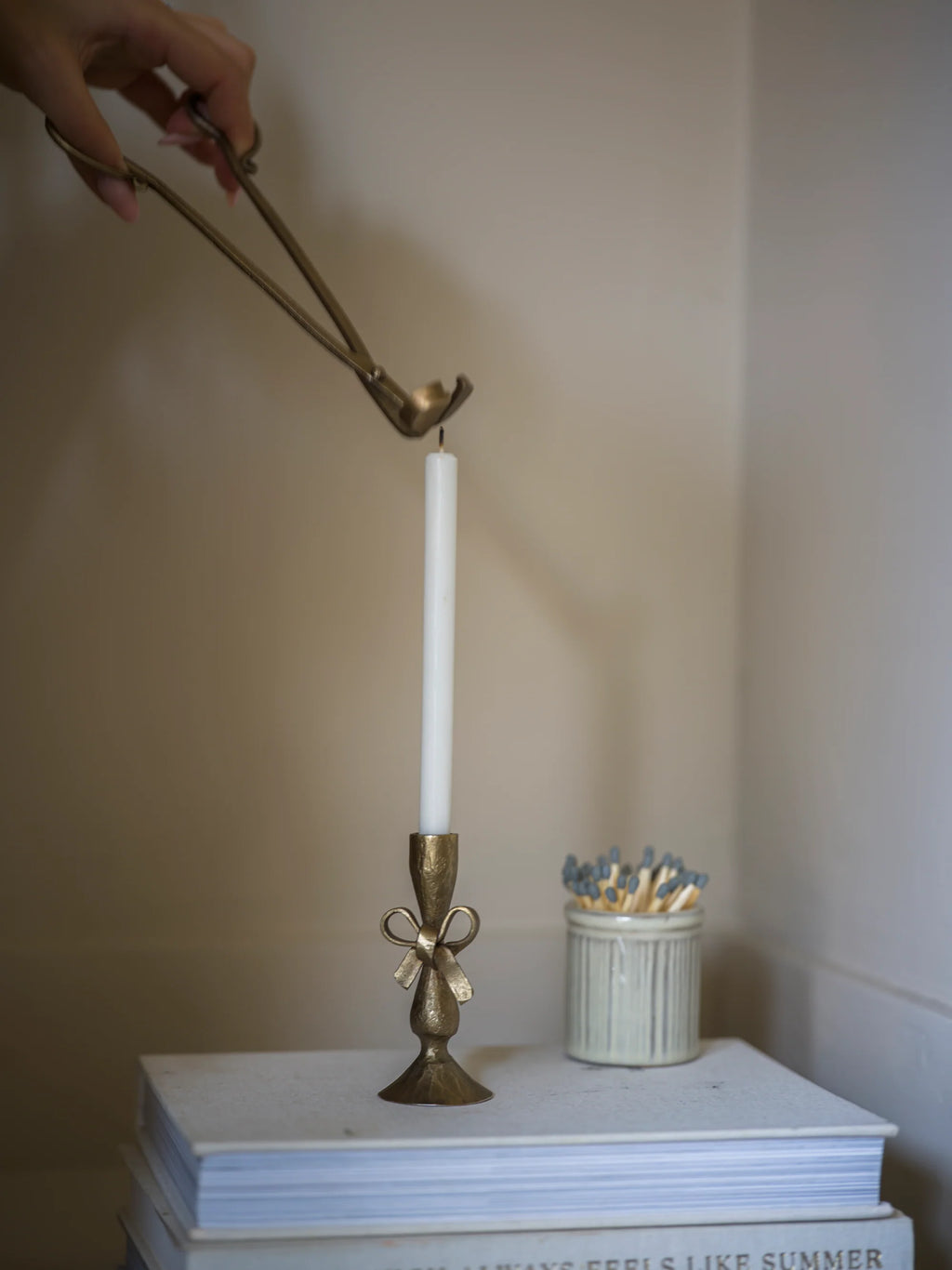 Antique brass bow candle holder