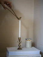 Antique brass bow candle holder