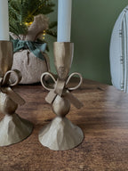 Antique brass bow candle holder
