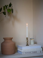 Antique brass bow candle holder
