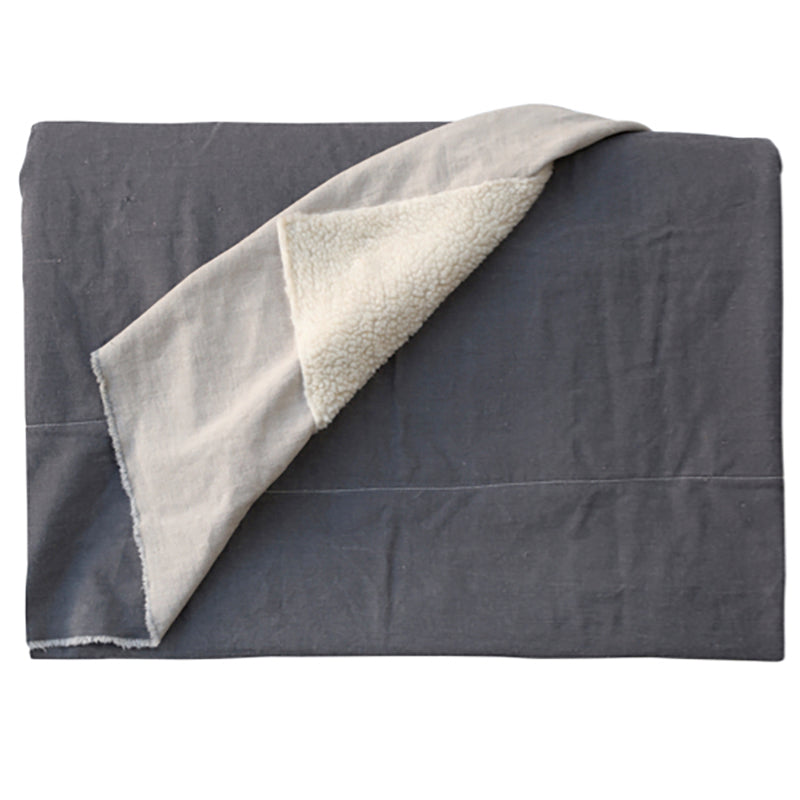 Grey throw with sheepskin