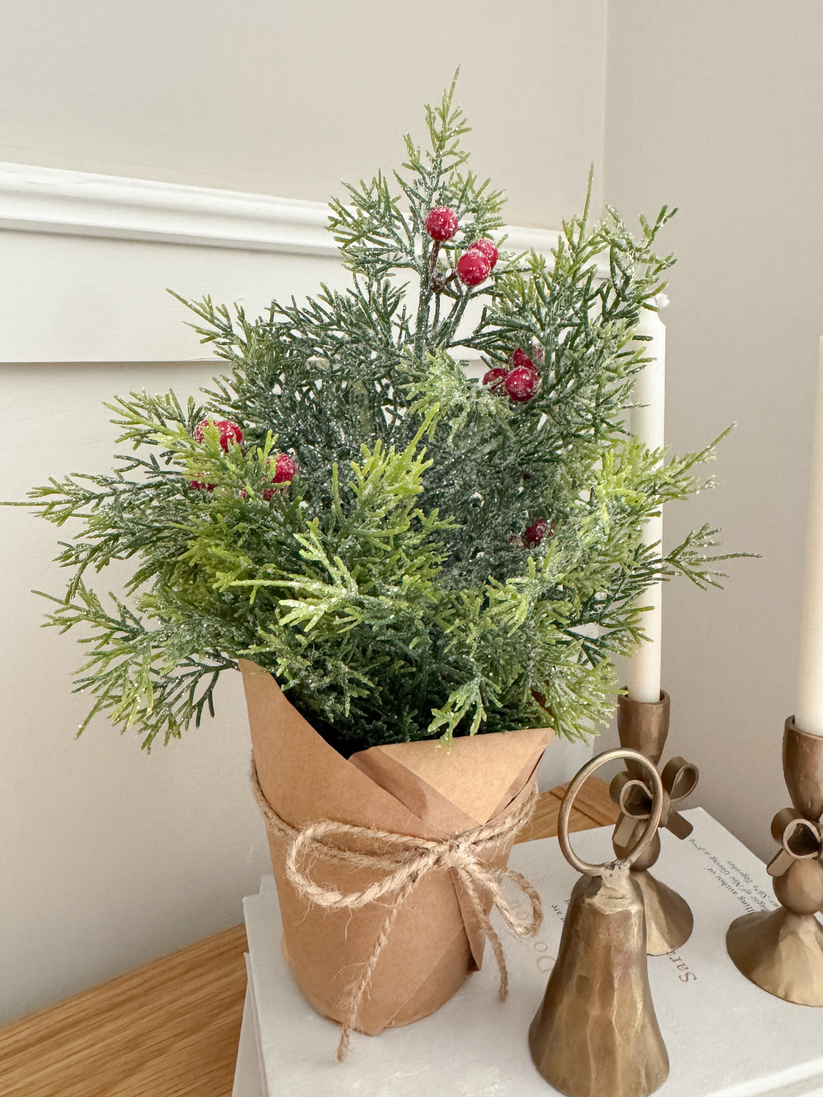 Frosted cypress with berries in pot