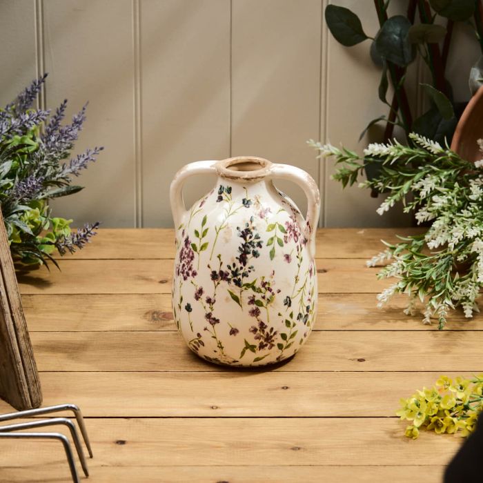 Distressed floral urn