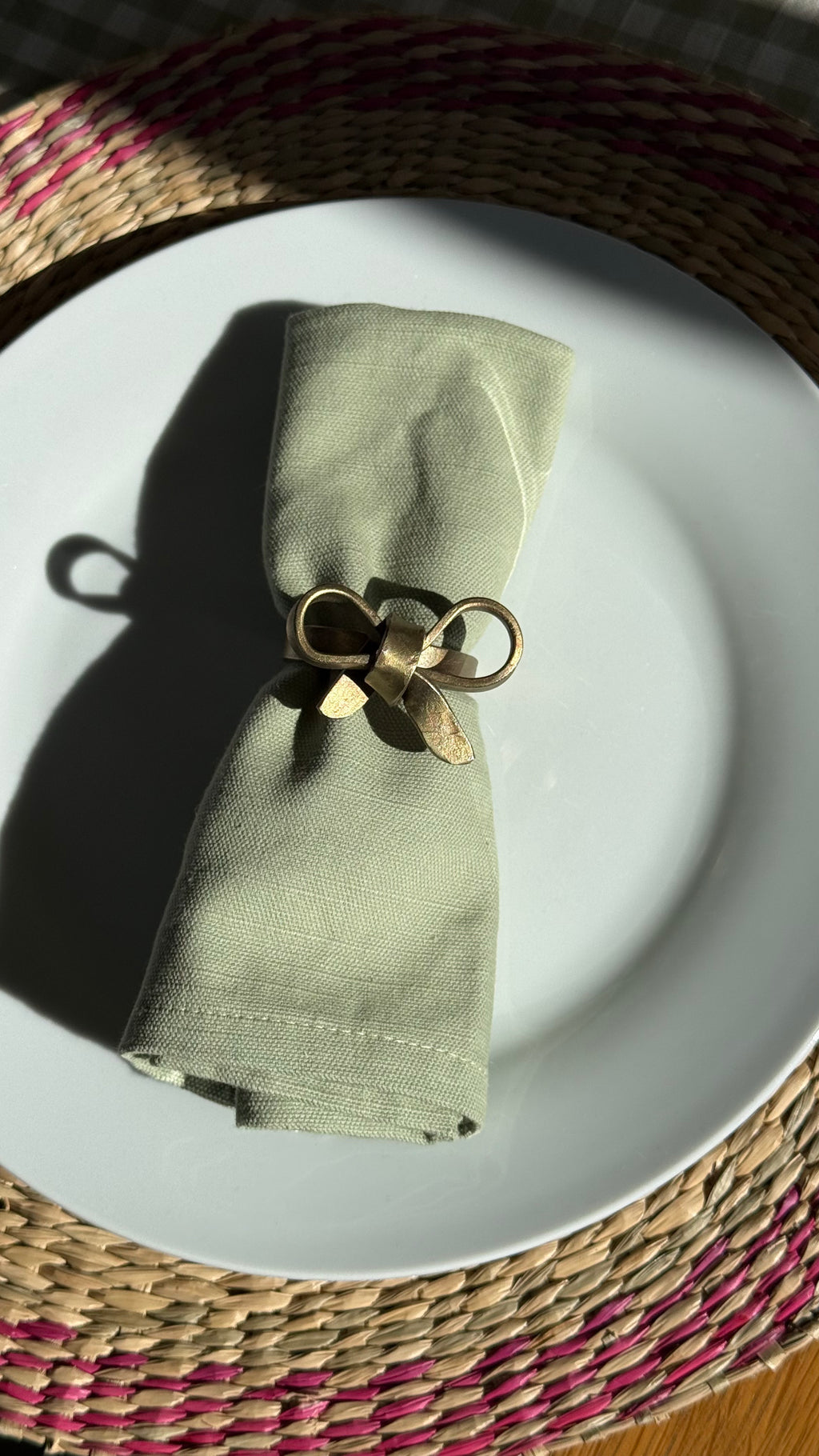 Antique brass bow napkin ring