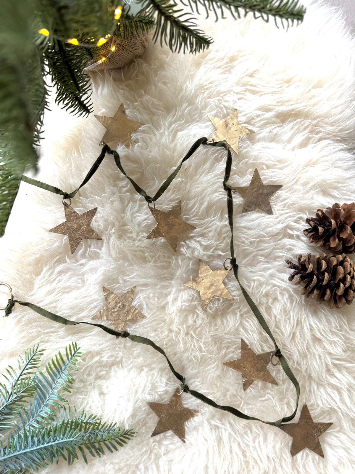 Brass star garland on velvet ribbon